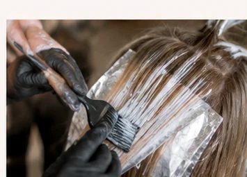 Professional foil highlighting and hair color application